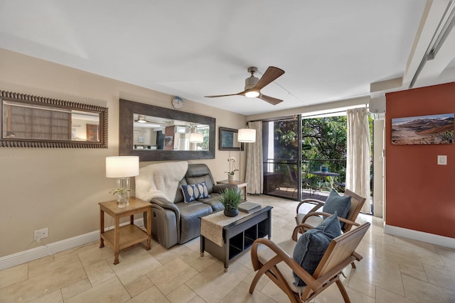 living room featuring floor to ceiling windows and ceiling fan