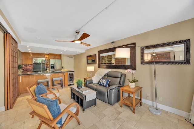 living room with wine cooler and ceiling fan