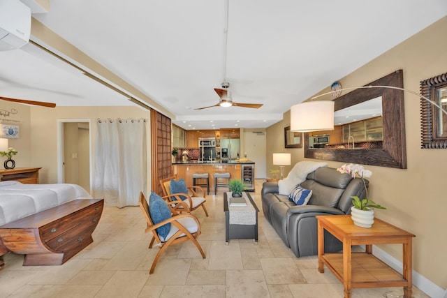 living room featuring ceiling fan, beverage cooler, and a wall unit AC