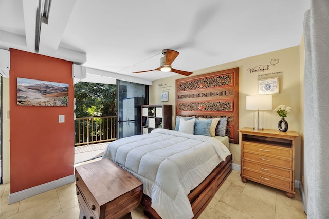 tiled bedroom featuring access to outside, ceiling fan, and a wall of windows