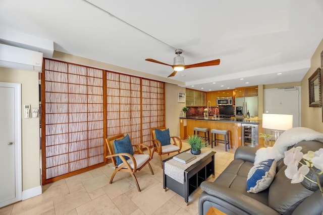 living room featuring wine cooler and sink