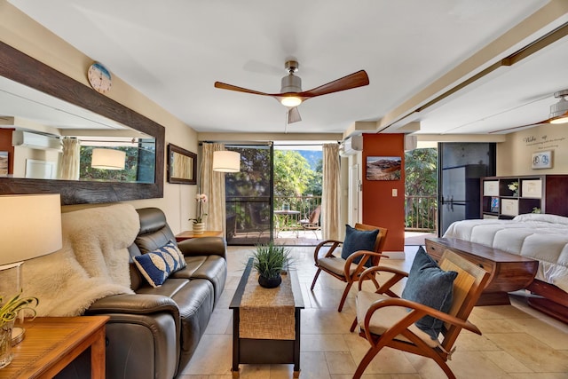 living room featuring ceiling fan, a wall of windows, and a wall mounted AC