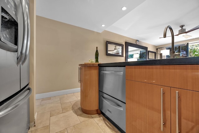 kitchen featuring stainless steel fridge with ice dispenser