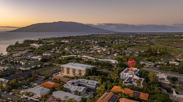 aerial view at dusk with a water and mountain view