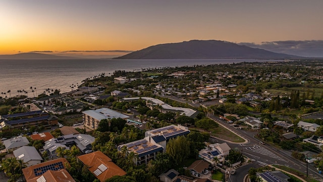 aerial view at dusk with a water and mountain view