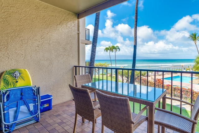 balcony featuring a water view