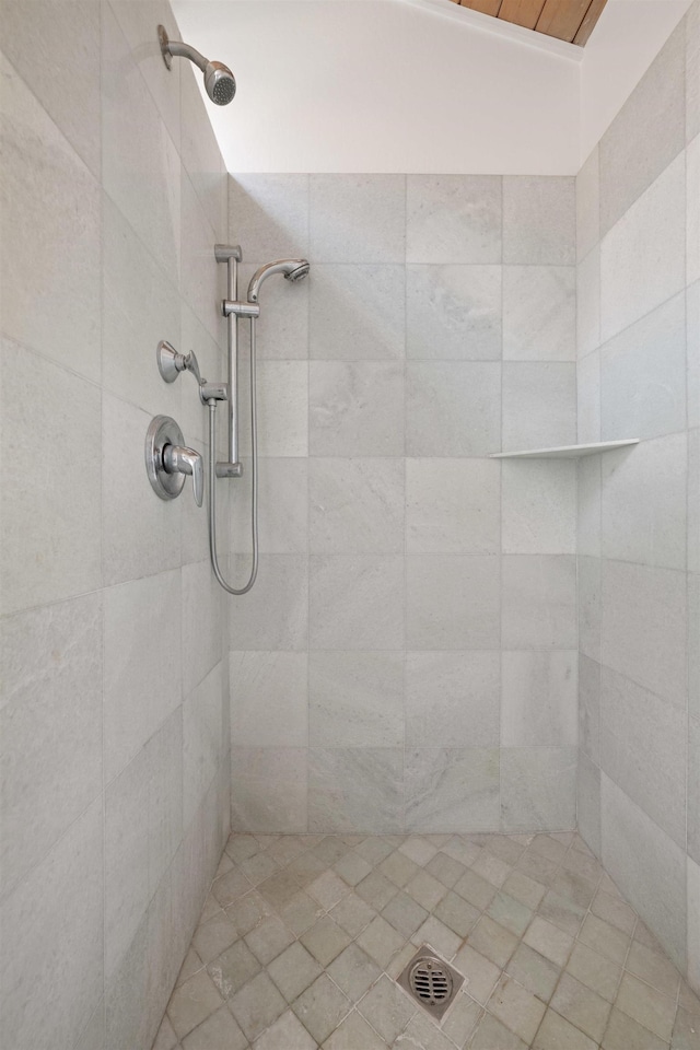 bathroom with a tile shower