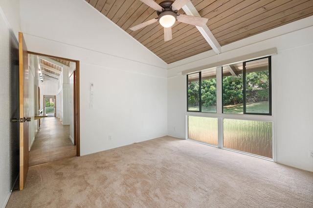 carpeted spare room featuring high vaulted ceiling, wooden ceiling, and a ceiling fan