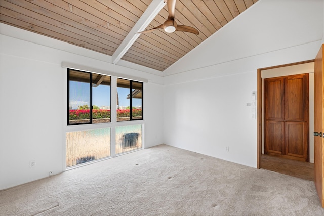 carpeted spare room featuring wood ceiling, a ceiling fan, and high vaulted ceiling