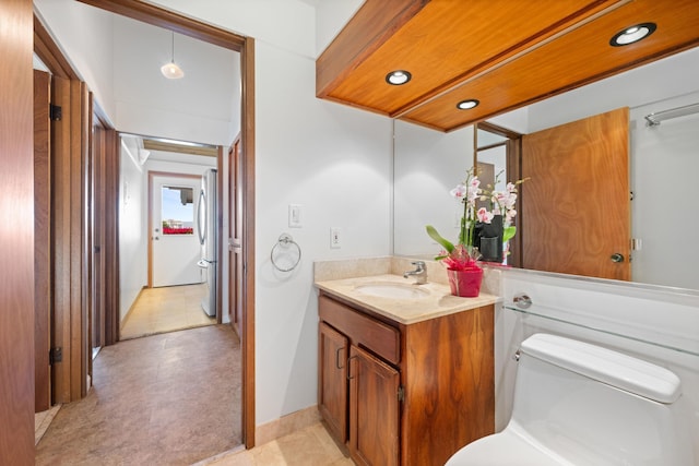 bathroom with toilet and vanity