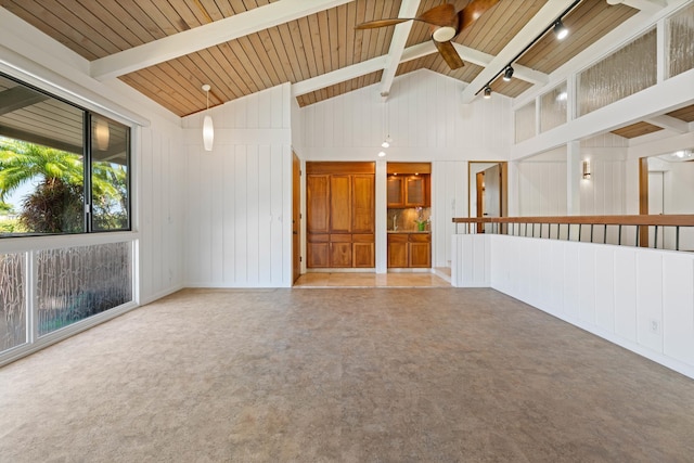 empty room featuring beam ceiling, high vaulted ceiling, a ceiling fan, rail lighting, and wood ceiling