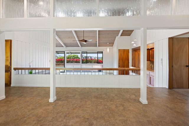 interior space featuring decorative backsplash and wood ceiling