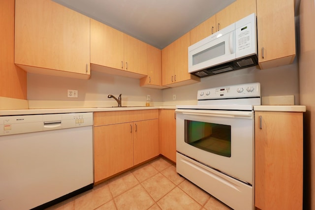 kitchen with white appliances, light brown cabinets, sink, and light tile patterned floors