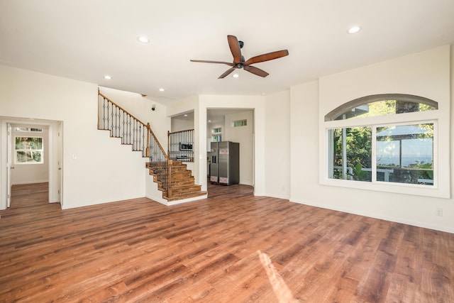 425 Kaukini Loop, Wailuku, HI 96793 - unfurnished living room with healthy amount of natural light, wood finished floors, recessed lighting, stairway, and ceiling fan