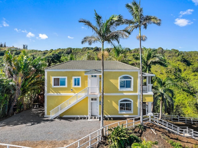 425 Kaukini Loop, Wailuku, HI 96793 - coastal inspired home with stucco siding, stairway, and a tile roof