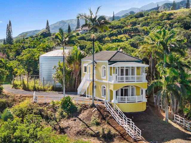 425 Kaukini Loop, Wailuku, HI 96793 - view of front of house featuring stairs, a mountain view, a balcony, and stucco siding