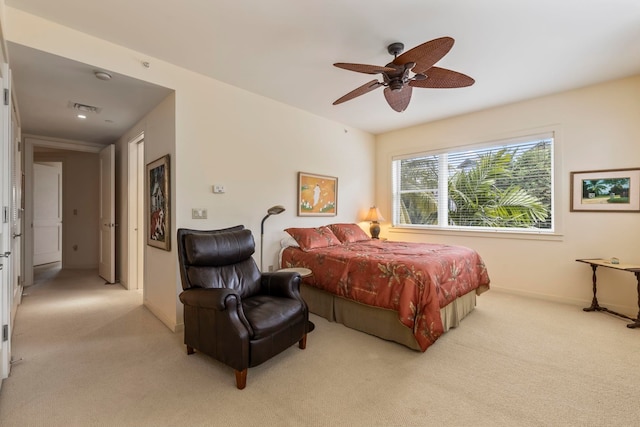 bedroom with ceiling fan and light colored carpet