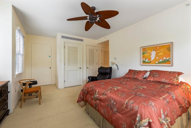 carpeted bedroom with ceiling fan