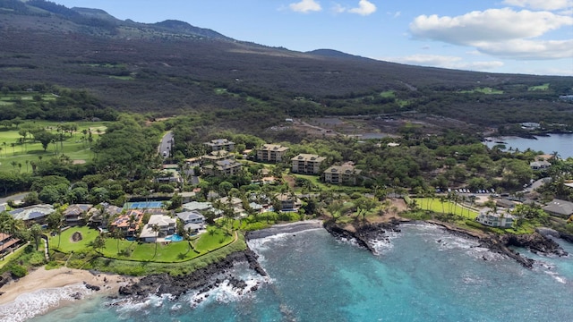 aerial view featuring a water and mountain view