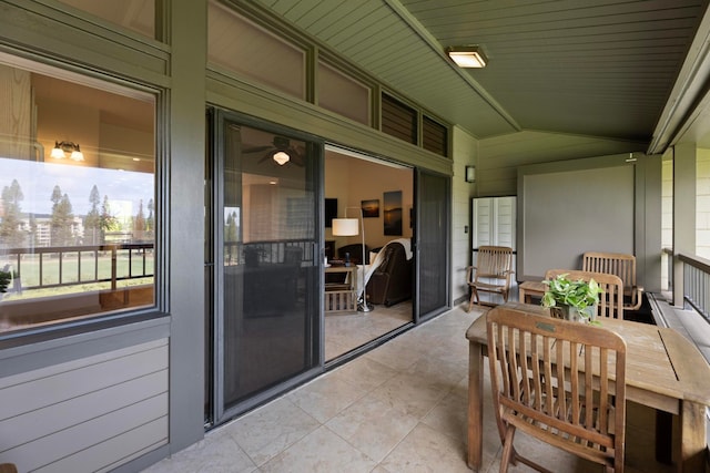 sunroom / solarium featuring wooden ceiling and lofted ceiling