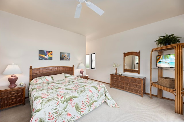 bedroom featuring light carpet and ceiling fan