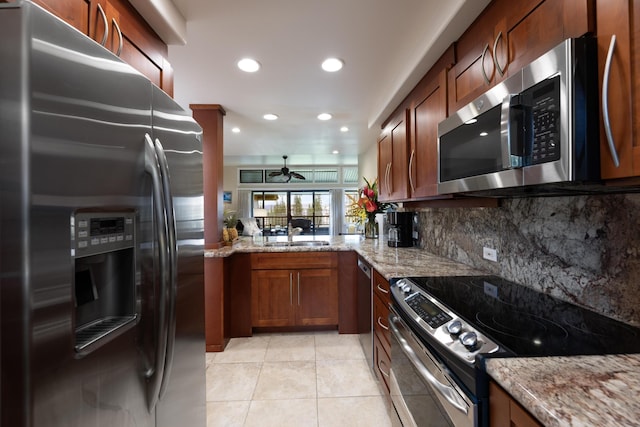 100 Ridge Rd Unit 723, Lahaina, HI 96761 - kitchen featuring stainless steel appliances, backsplash, ceiling fan, light stone countertops, and light tile patterned flooring