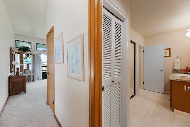 corridor with light colored carpet