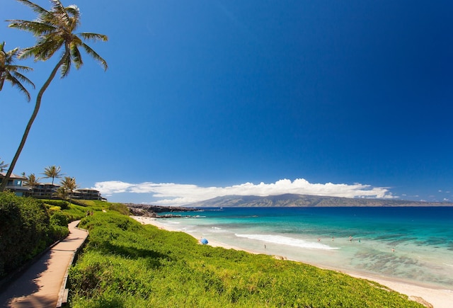 property view of water with a view of the beach and a mountain view