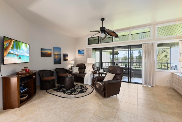 living room with ceiling fan and light tile patterned flooring