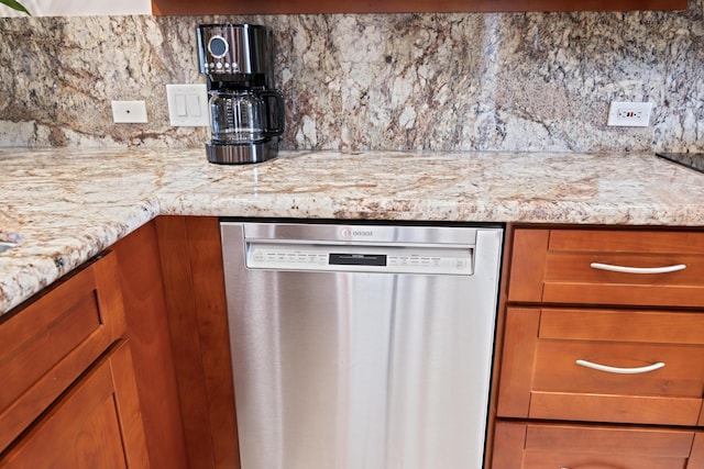 100 Ridge Rd Unit 723, Lahaina, HI 96761 - kitchen featuring dishwasher, backsplash, brown cabinetry, and light stone countertops