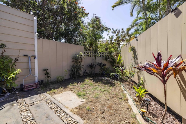 view of yard with a fenced backyard