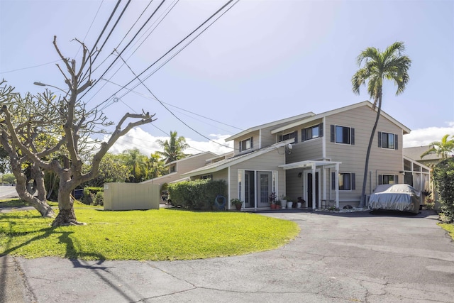 view of front of house with a front lawn and driveway