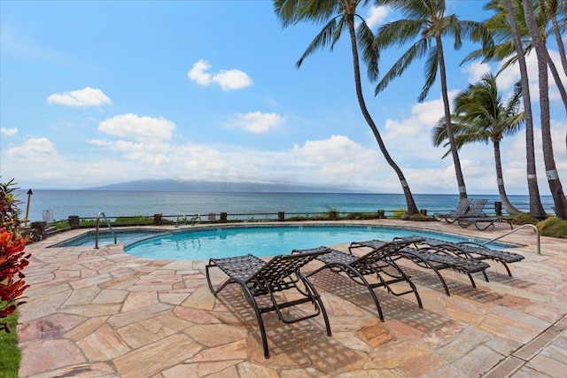 view of pool with a water view