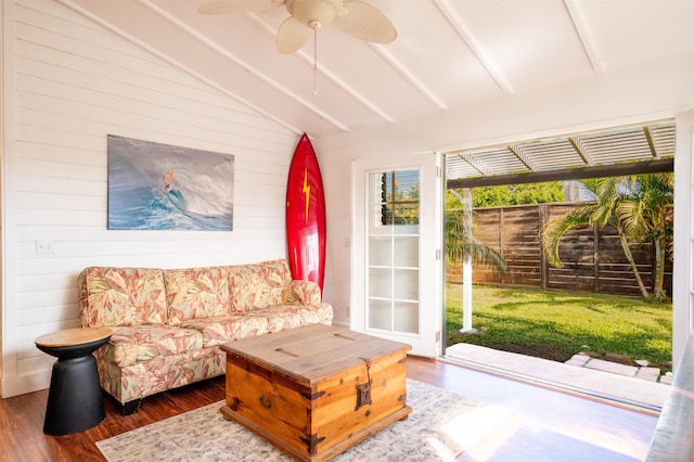 sunroom featuring ceiling fan and lofted ceiling