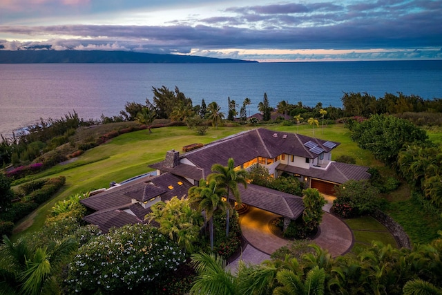 aerial view at dusk with a water view