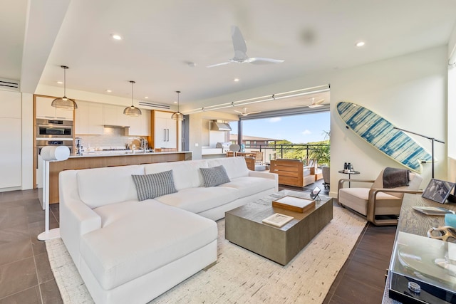 living room with tile patterned floors and ceiling fan