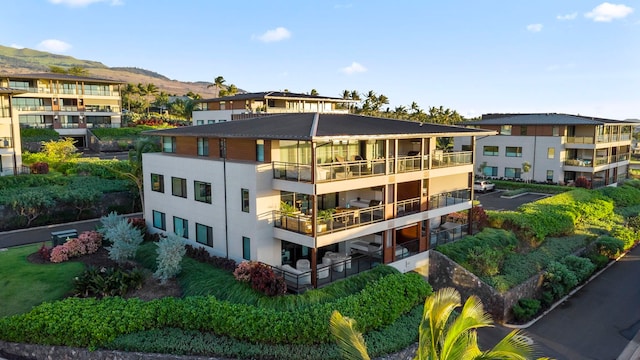 rear view of house featuring a mountain view