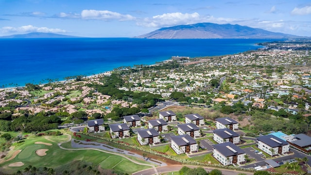 aerial view featuring a water and mountain view