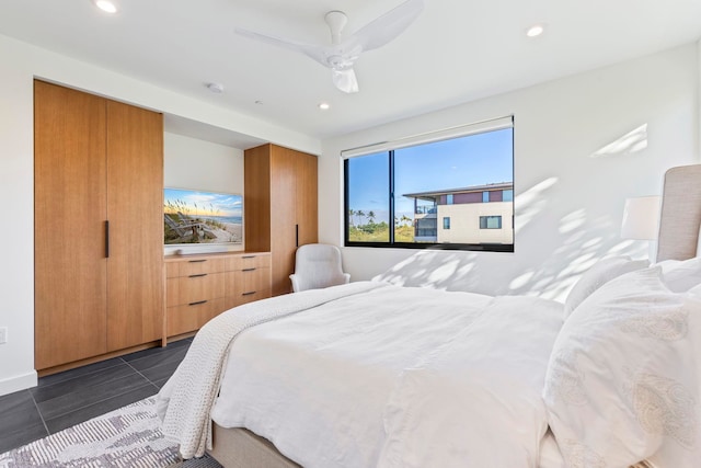 tiled bedroom with ceiling fan