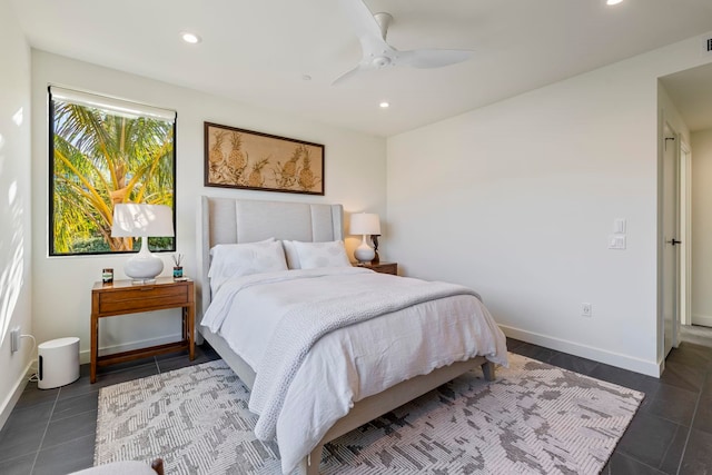 bedroom with dark tile patterned flooring and ceiling fan