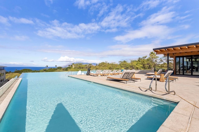 view of swimming pool featuring a patio area