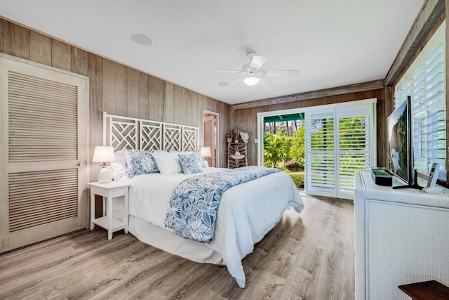 bedroom featuring access to outside, ceiling fan, and hardwood / wood-style flooring