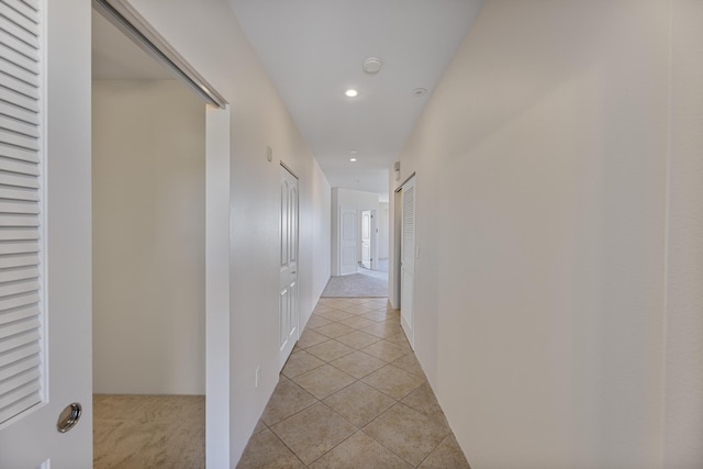 hallway with light tile patterned floors