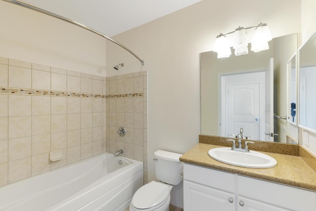 full bathroom with vanity, toilet, and tiled shower / bath