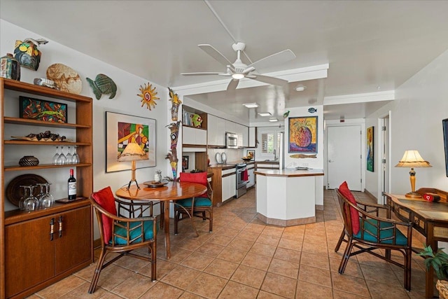 70 Hauoli St Unit 217, Wailuku, HI 96793 - dining space with ceiling fan and light tile patterned floors