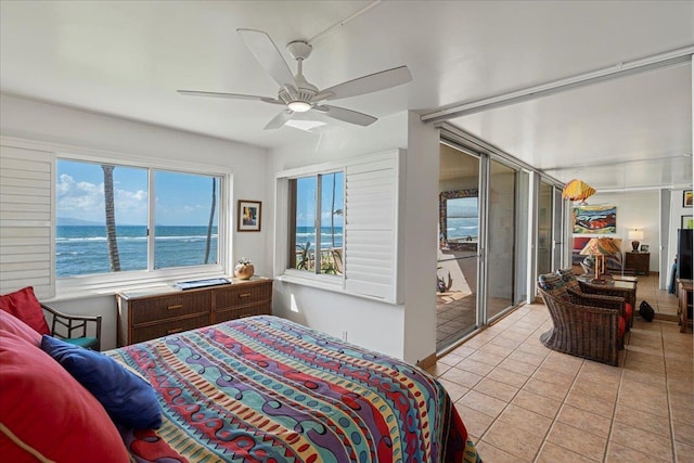 70 Hauoli St Unit 217, Wailuku, HI 96793 - bedroom with light tile patterned floors, a water view, ceiling fan, and access to outside