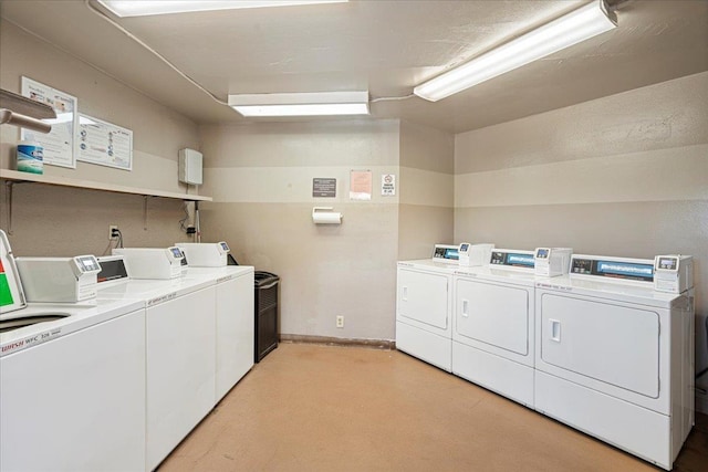 70 Hauoli St Unit 217, Wailuku, HI 96793 - community laundry featuring washer and clothes dryer, light carpet, and baseboards