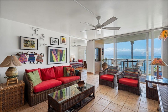 70 Hauoli St Unit 217, Wailuku, HI 96793 - living area with a ceiling fan, a wall of windows, a water view, and light tile patterned floors