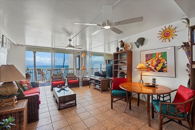 70 Hauoli St Unit 217, Wailuku, HI 96793 - tiled living area featuring a ceiling fan and a wall of windows