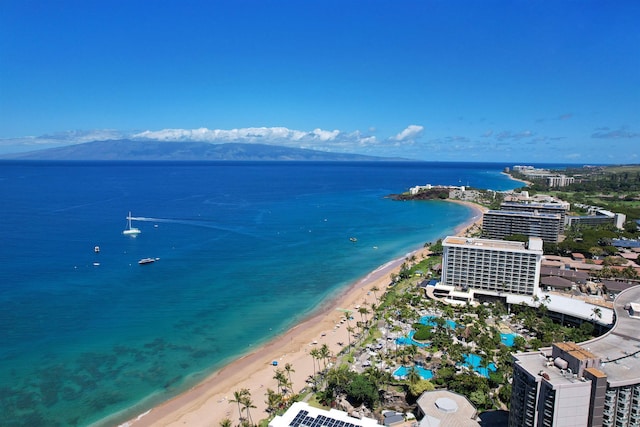 birds eye view of property featuring a water view and a view of the beach